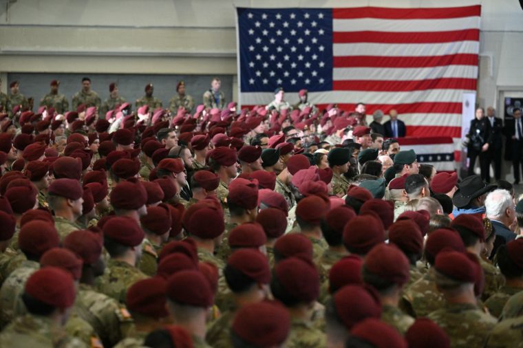 Members of the military and their families look on as US President Donald Trump speaks at Fort Bragg, North Carolina on February 13, 2026. Trump will meet on Friday with the special forces soldiers who captured Venezuelan leader Nicolas Maduro in a deadly raid in Caracas in January. (Photo by Mandel NGAN / AFP via Getty Images)
