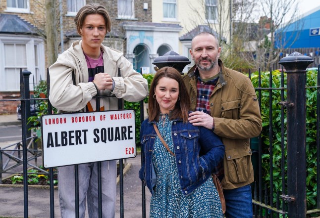 Vicki Fowler and Ross and Joel Marshall stood around the 'Albert Square' sign in EastEnders