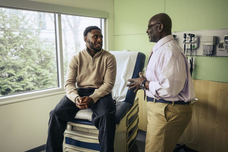 Doctor discussing treatment options with patient after medical exam