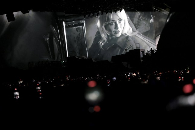 Sabrina Carpenter appears on the screen as she performs at the Coachella Valley Music and Arts Festival in Indio, California, U.S., April 10, 2026. REUTERS/Daniel Cole