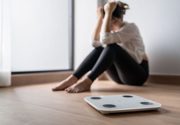 Sad woman with scales