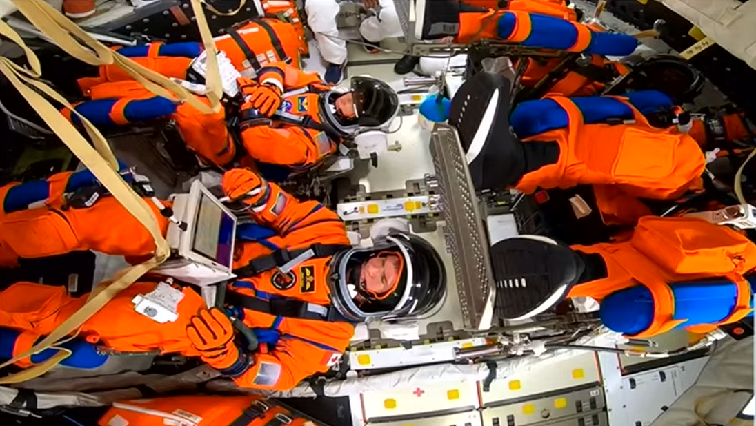 Artemis 2 astronauts loaded into their capsule.