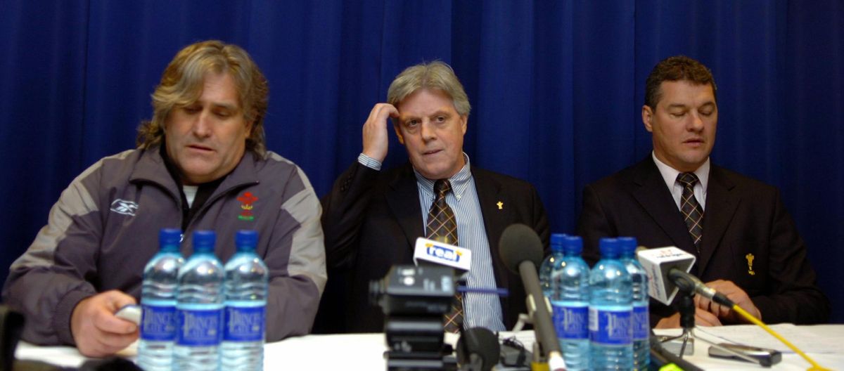 Wales assistant coach Scott Johnson (L), chief executive WRU Steve Lewis (C) and chairman of the WRU David Pickering talk to the media during a press conference after Ruddock's exit