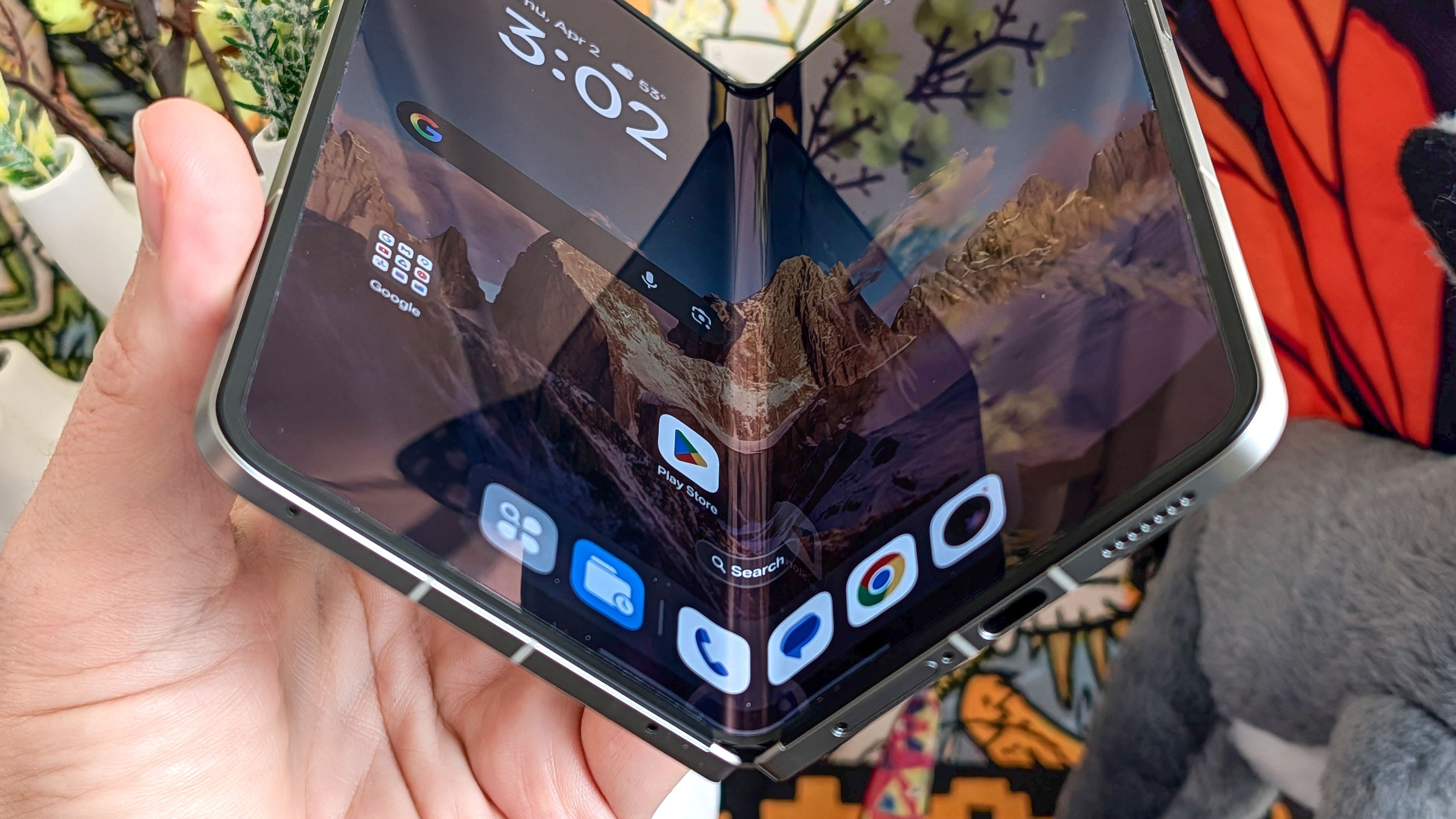 Oppo Find N6 held in the hand.