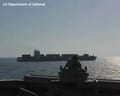 US navy ship fires on vessel trying to get past blockade