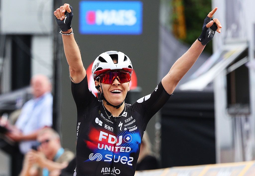 C&eacute;lia Gery raises her arms in celebration as she wins Brabantse Pijl