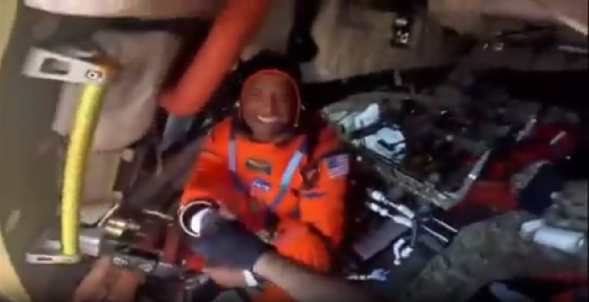NASA pilot Victor Glover fist bumps U.S. Navy divers on Friday