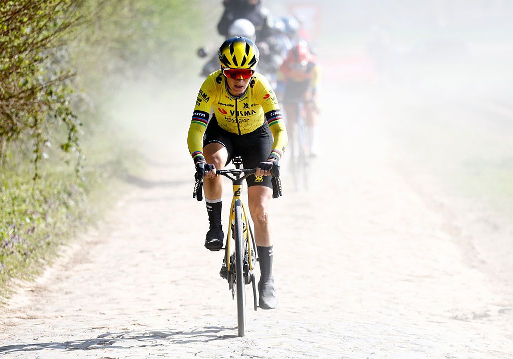 A head-on shot of Pauline Ferrand-Pr&eacute;vot riding on a cobbled section of Paris-Roubaix in 2025. It is bright and dusty behind her