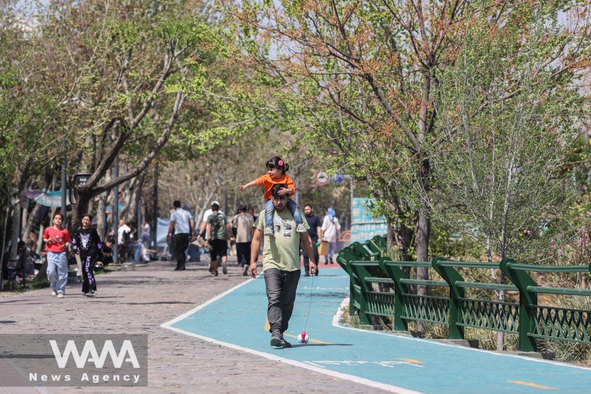 Iranians gather at a park on Nature Day in Tehran