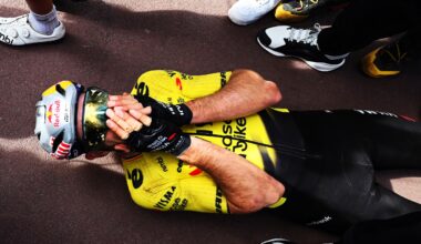 Wout van Aert lies on the ground, holding his face in disbelief after winning Paris-Roubaix 2026