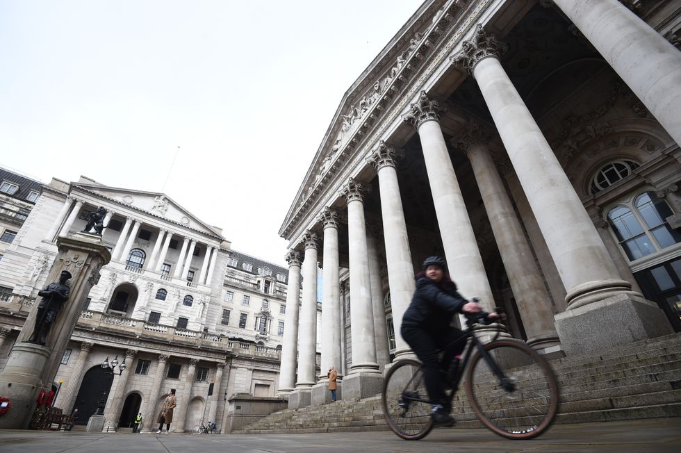 A cyclist outside the Bank of England