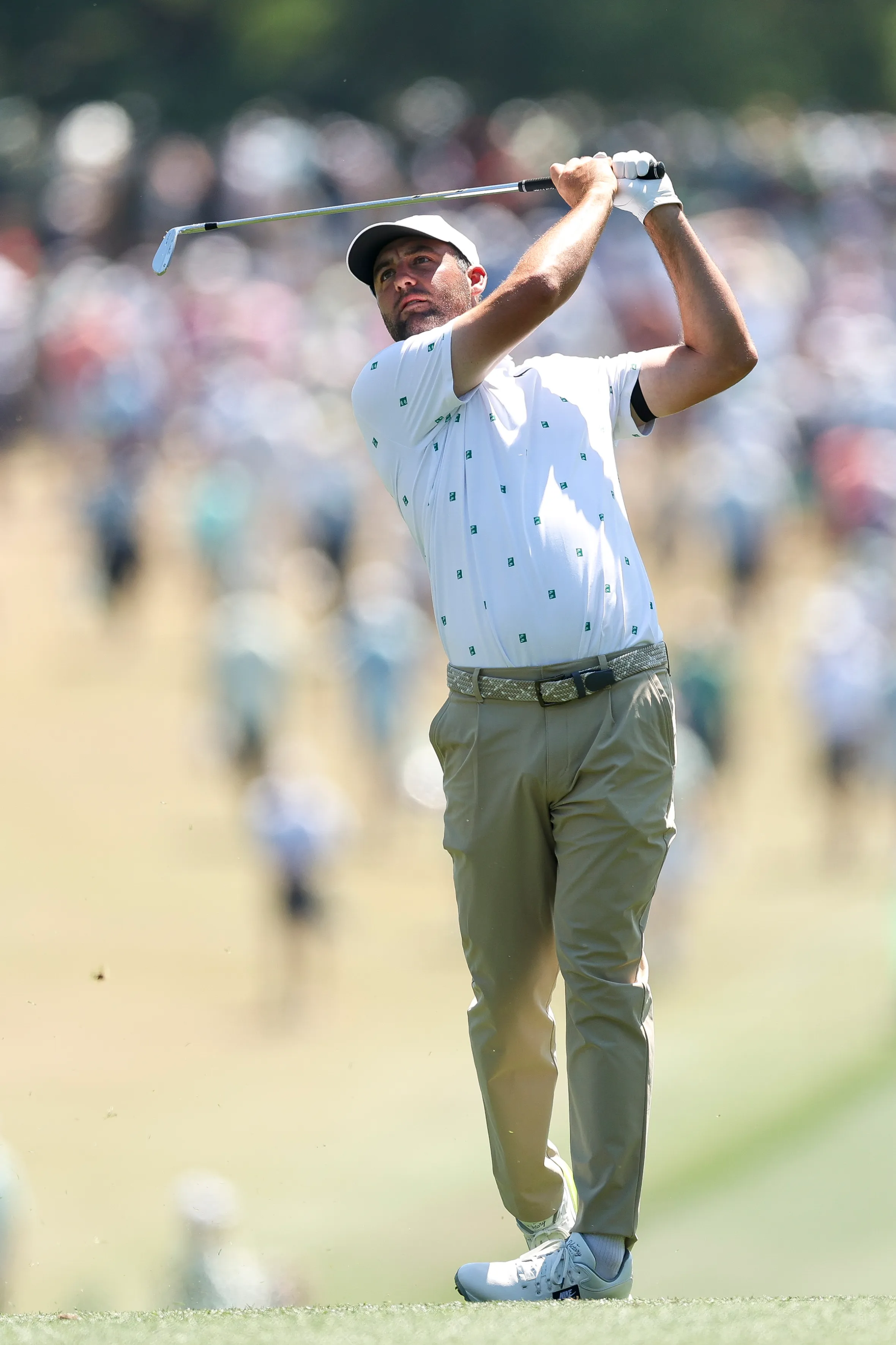 Scottie Scheffler in mid-swing on the first hole during the third round of the 2026 Masters Tournament.