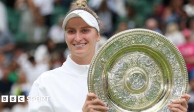 Marketa Vondrousova holding the Wimbledon trophy after winning the women's title in 2023