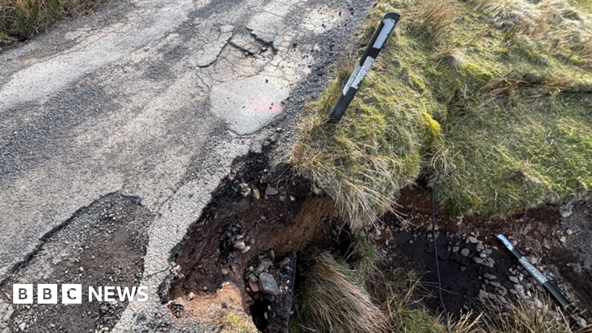 Three people, a family, stand together in front of a stone wall. The woman, Megan Byatt, is 39 with blonde hair tied back and is wearing a dark red top. The man, Harry Byatt, has a blue top and cap with a black stubble. His daughter, who looks about 11, has a brown top on and dark hair.
