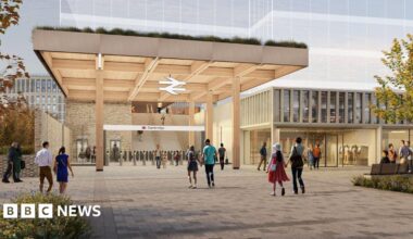 A CGI mock-up of a the proposed new entrance to Cambridge railway station. It is a brown timber construction.