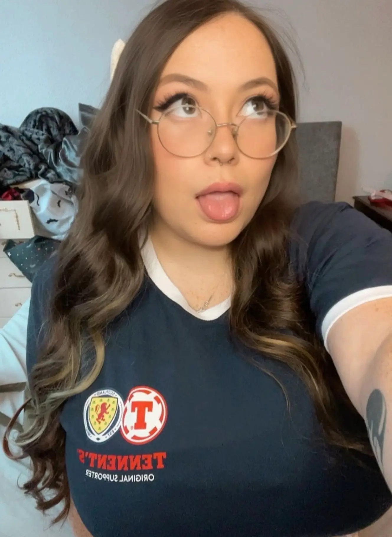 She said she now 'genuinely loves' her boobs and her body (Instagram/@scotchdolly97)