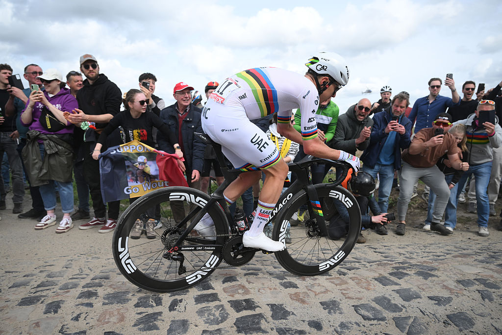 A side shot of Tadej Pogačar tackling a rough cobbled sector during Paris-Roubaix 2026