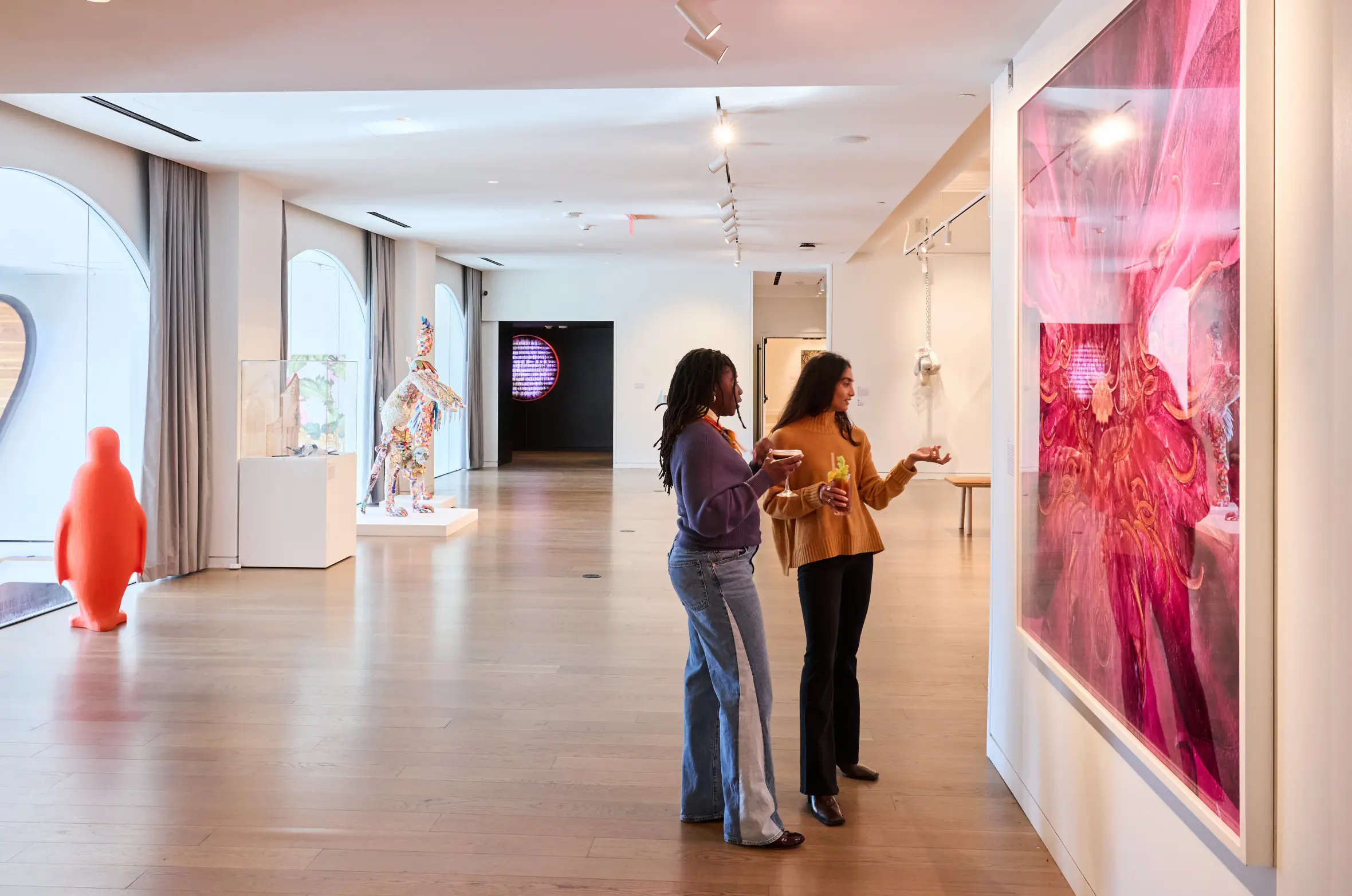 Two women looking at art in the 21c Museum Hotel St. Louis.