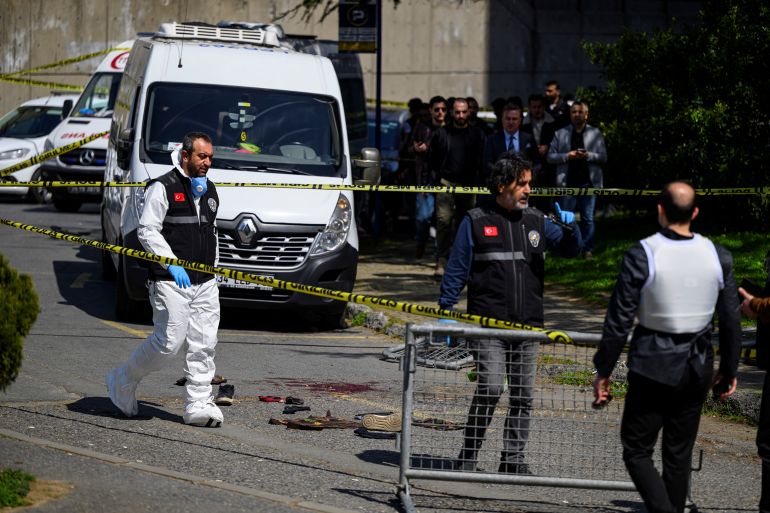 TOPSHOT - Police officials gather outside The Israeli Consulate in Istanbul on April 7, 2026, following a shootout between gunmen and police.