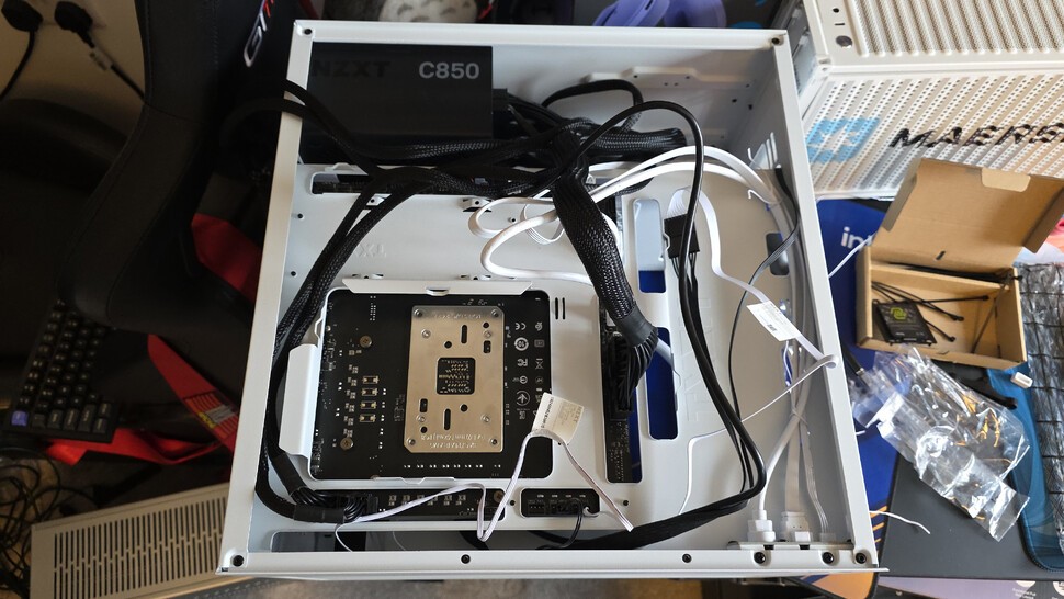 And here's a few minutes later, with all of the cables plugged in but not yet tidied. If we didn't care about aesthetics, we could just put the back cover on at this point.