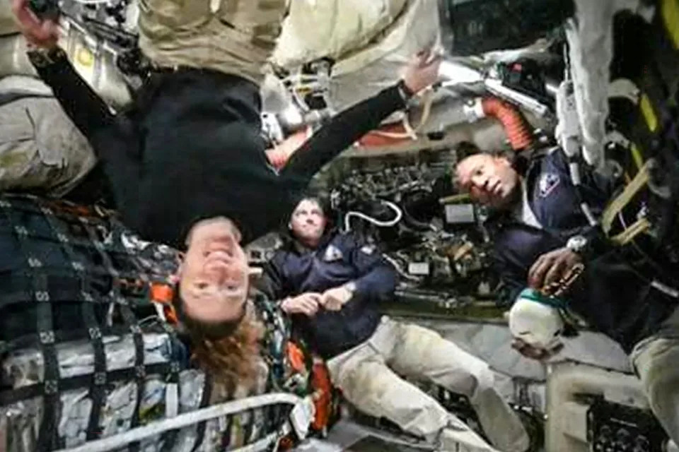 This screen grab from NASA's feed released on April 3, 2026, shows the four Artemis II crew members (L-R) Canadian Space Agency (CSA) astronaut Jeremy Hansen, Artemis II mission specialist (hidden), NASA astronauts Reid Wiseman, Artemis II commander, Christina Koch, Artemis II mission specialist and Victor Glover, Artemis II pilot as they head to orbit the Moon for the first time in more than half a century.