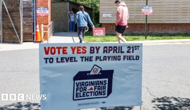 A "Vote Yes" sign as voters arrive to cast their ballots at a polling location inside Abingdon Elementary School during a special election in Arlington, Virginia, US, on Tuesday, April 21, 2026.