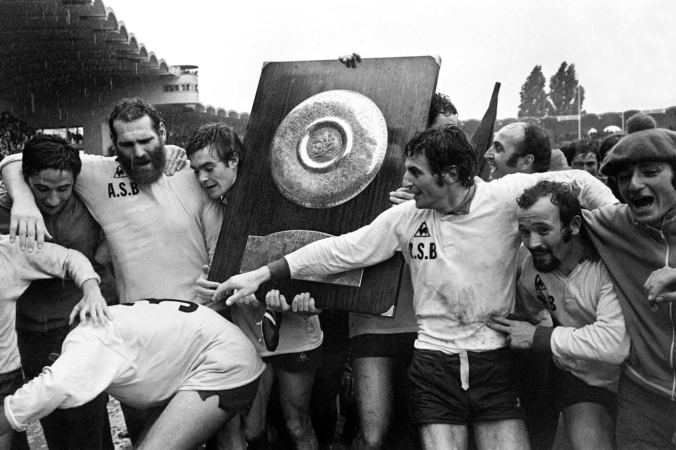 The players of Béziers rugby team celebrating with the Bouclier de Brennus after winning the French Championship.