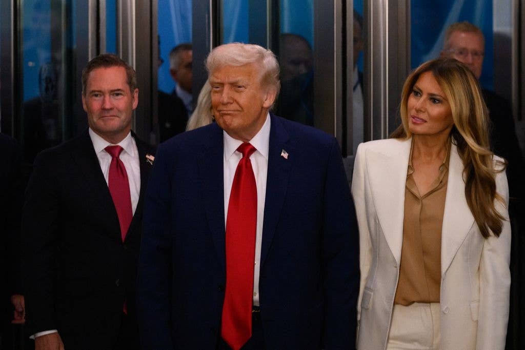 Melania Trump in white blazer and nude shirt