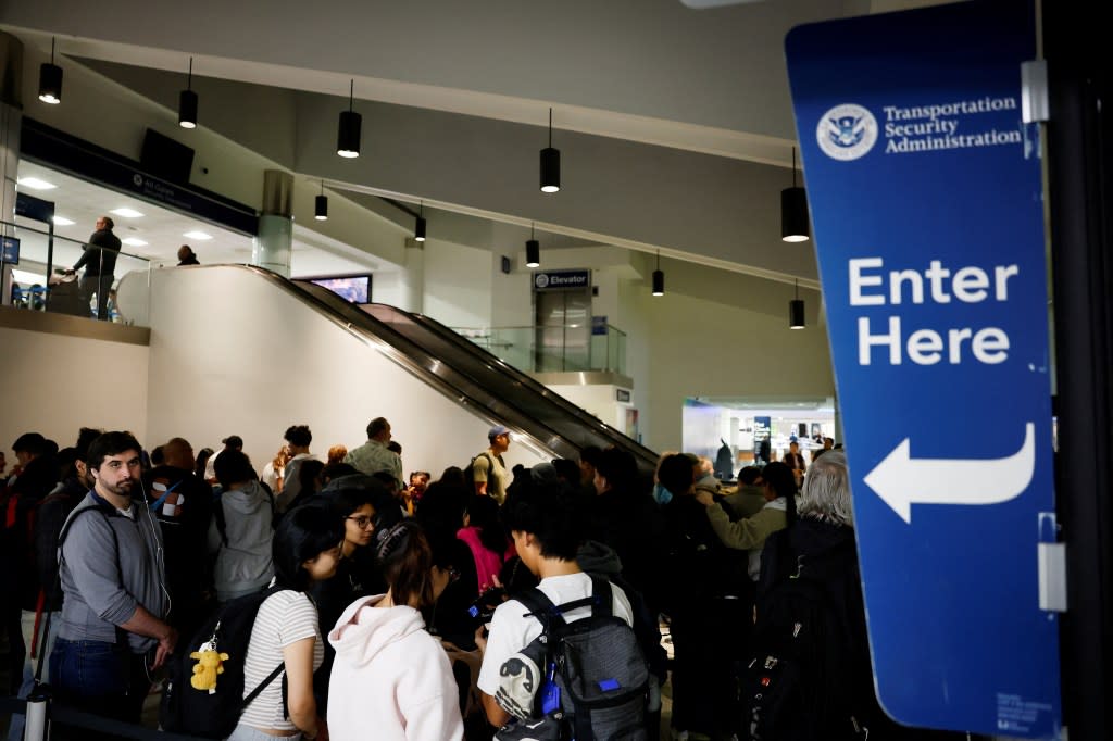 Passengers make their way to a TSA checkpoint at Los Angeles International Airport. REUTERS