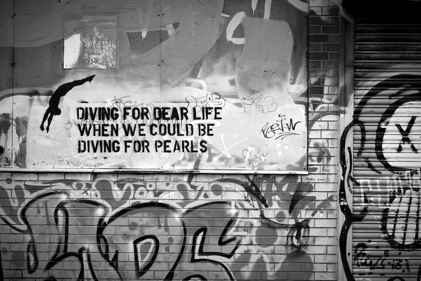 A wall with graffiti on it.