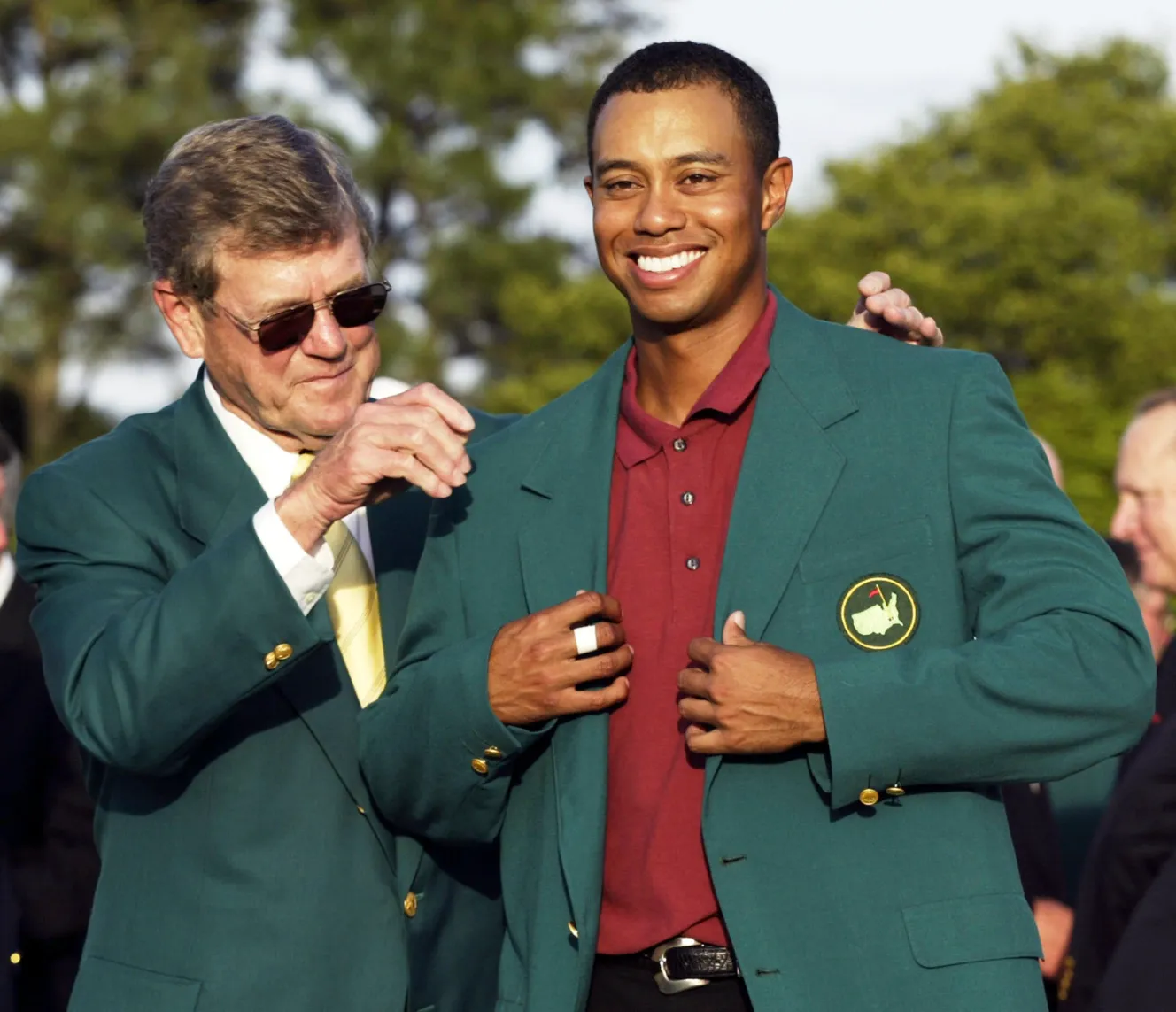 File photo of Tiger Woods being presented with the ceremonial green jacket at the 2002 Masters