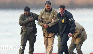 Nicolas Maduro is seen in handcuffs after landing at a Manhattan helipad, escorted by heavily armed Federal agents as they make their way into an armored car en route to a Federal courthouse in Manhattan on 5 January 2026 in New York City.