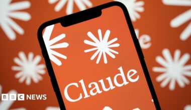 A logo of Claude on an iPhone, with a background of the company's star-like logo