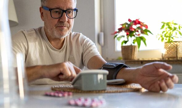A man with a blood pressure monitor