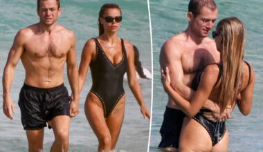 Brooks Nader and Taron Egerton take a dip during romantic Australia beach date