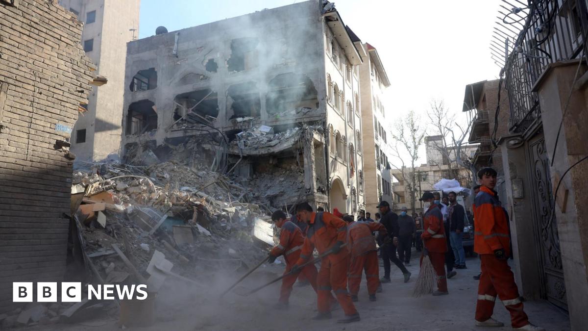 Iranian workers clear rubble at the site of a synagogue that was destroyed in an Israeli air strike, in Tehran, Iran (7 April 2026)