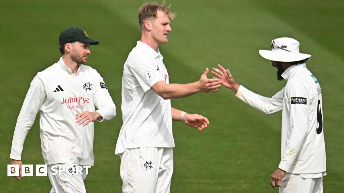 Dillon Pennington (centre) is congratulated by captain Haseeb Hameed (right, wearing a white floppy hat) as another Notts fielder (left) comes towards them