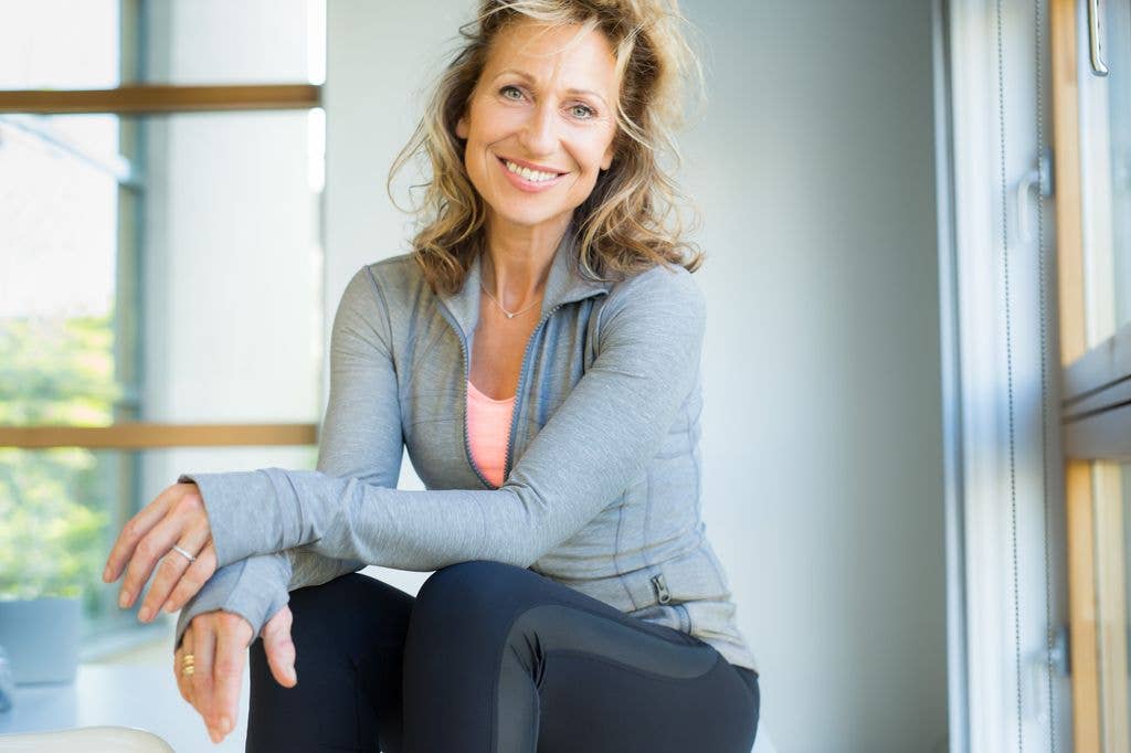 woman smiling in activewear