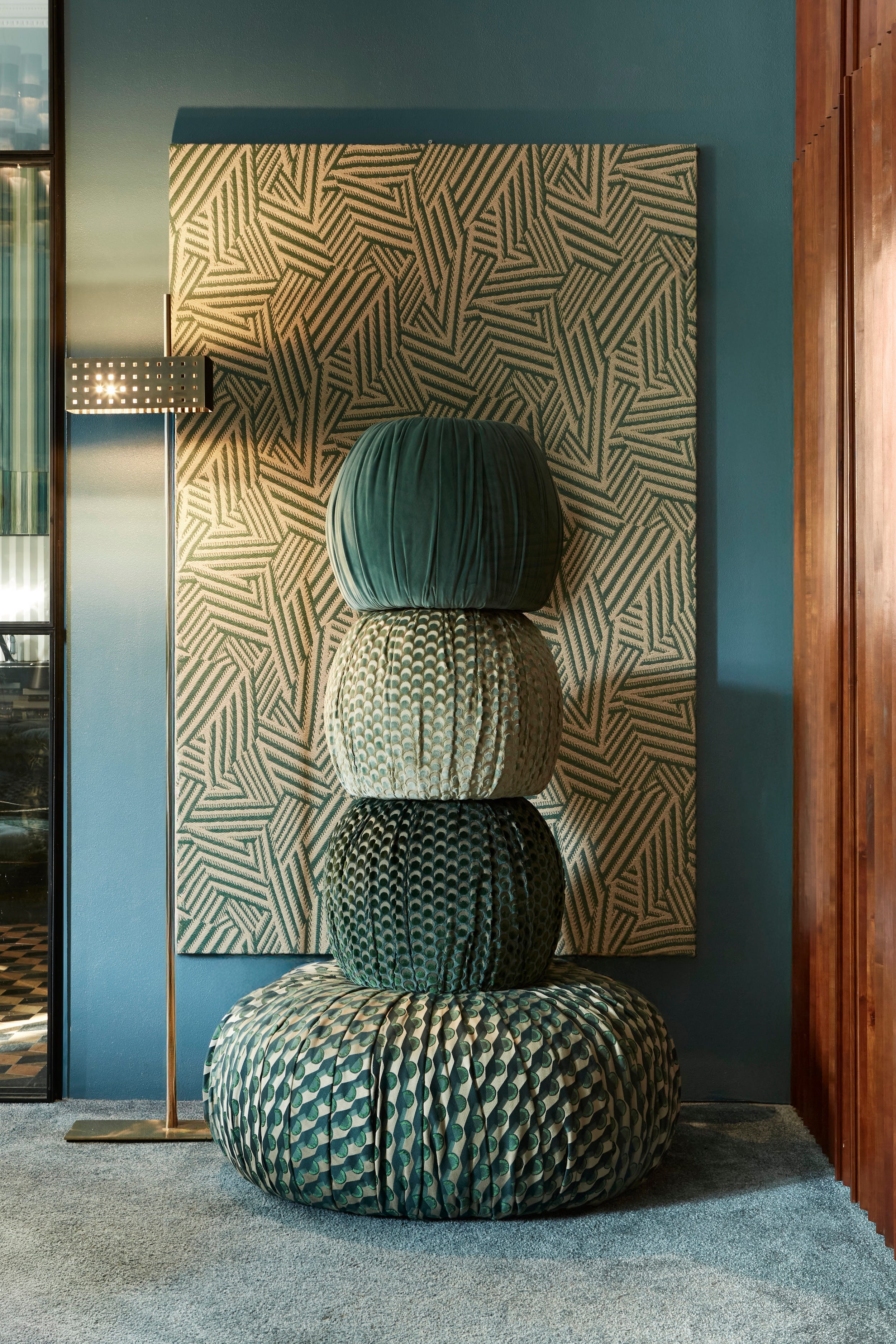 stack of decorative poufs in a stylish interior setting