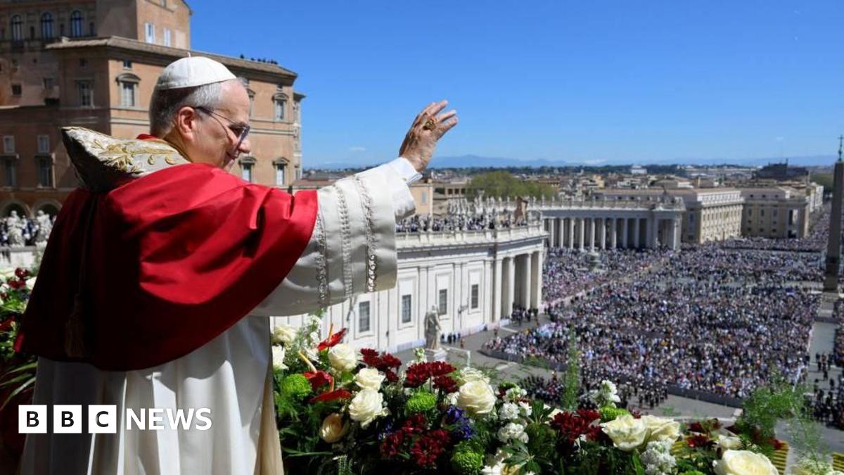 Pope Leo XIV waves from the main balcony of St. Peter's Basilica