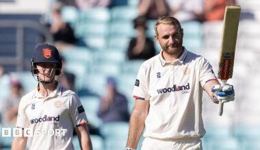 Paul Walter raises his bat after reaching three figures for Essex