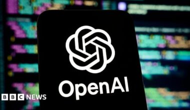 OpenAI logo on a smartphone screen, against a backdrop showing blurred lines of code.