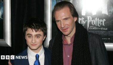 Actors Daniel Radcliffe and Ralph Fiennes pose for a picture at a premiere of Harry Potter and the Goblet of Fire.