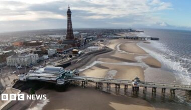 View of Blackpool from the air, showing the beach, Blackpool Tower and the piers