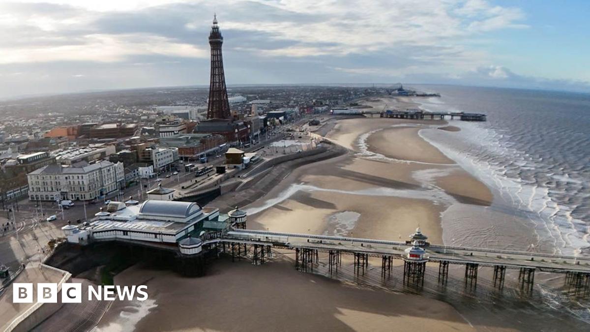 View of Blackpool from the air, showing the beach, Blackpool Tower and the piers