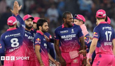 Ravi Bishnoi celebrates a wicket with Jofra Archer and the rest of his team-mates from Rajasthan Royals