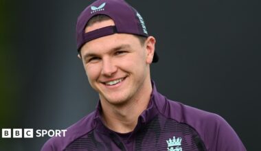 Sonny Baker, wearing a cap, smiles during England training