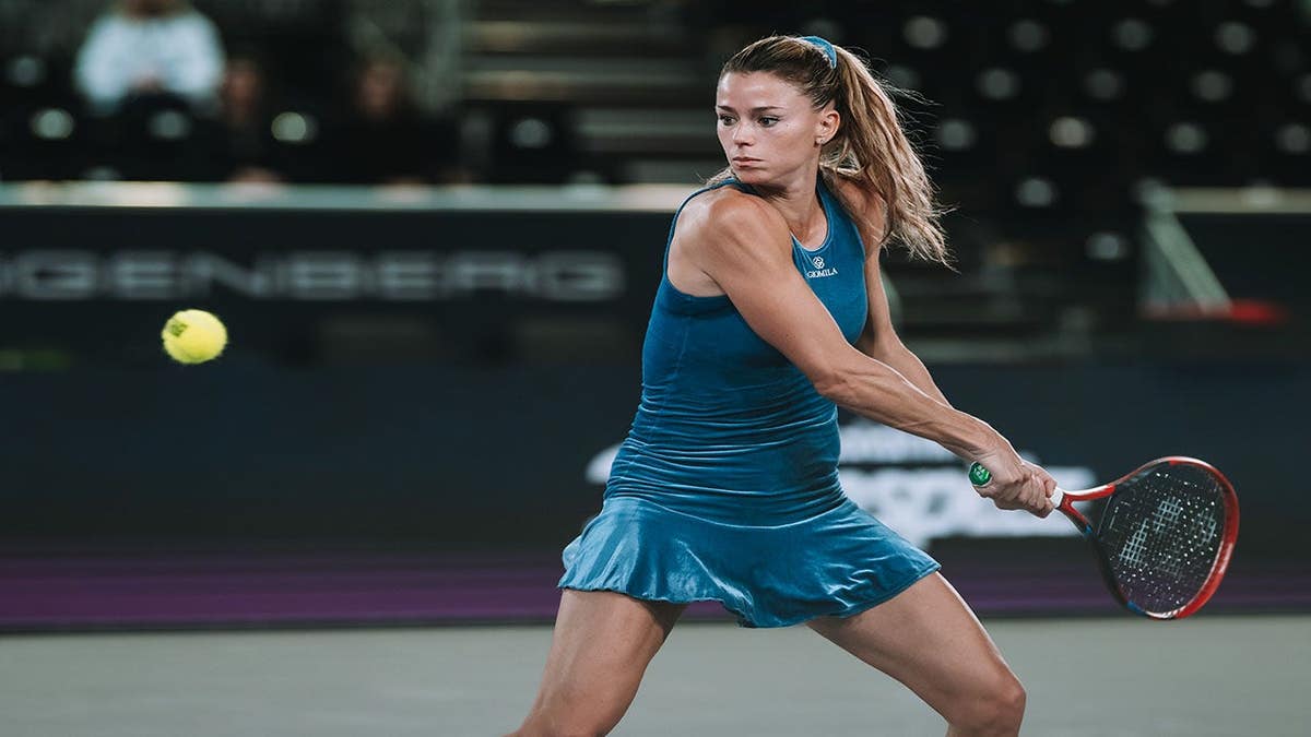 Camila Giorgi hitting a tennis shot during a match in Linz, Austria