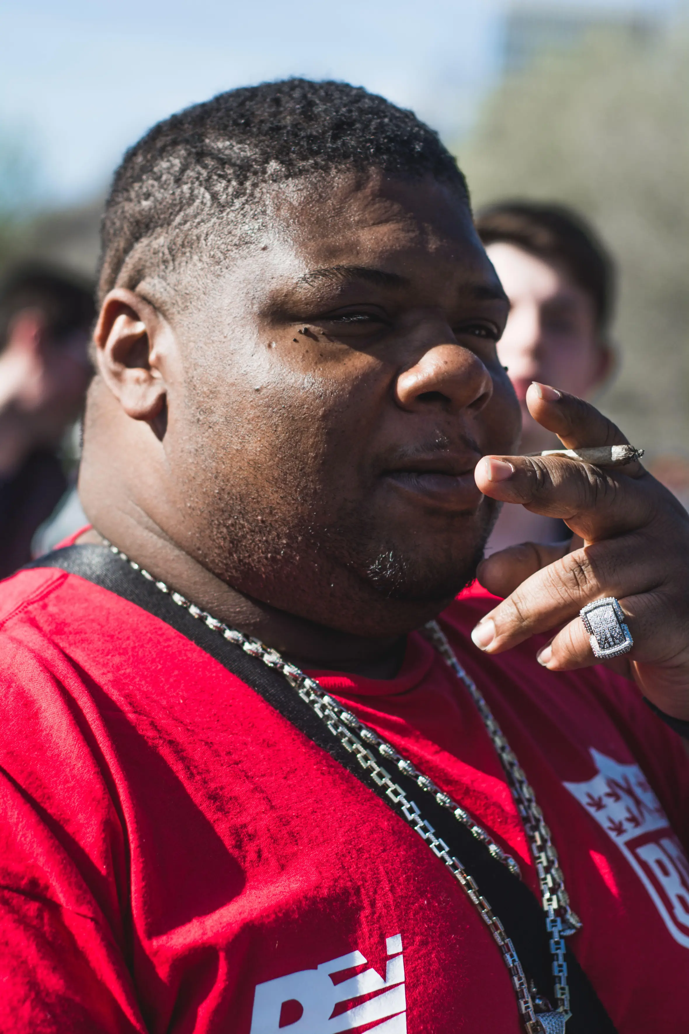 Big Narstie smoking a cannabis joint.