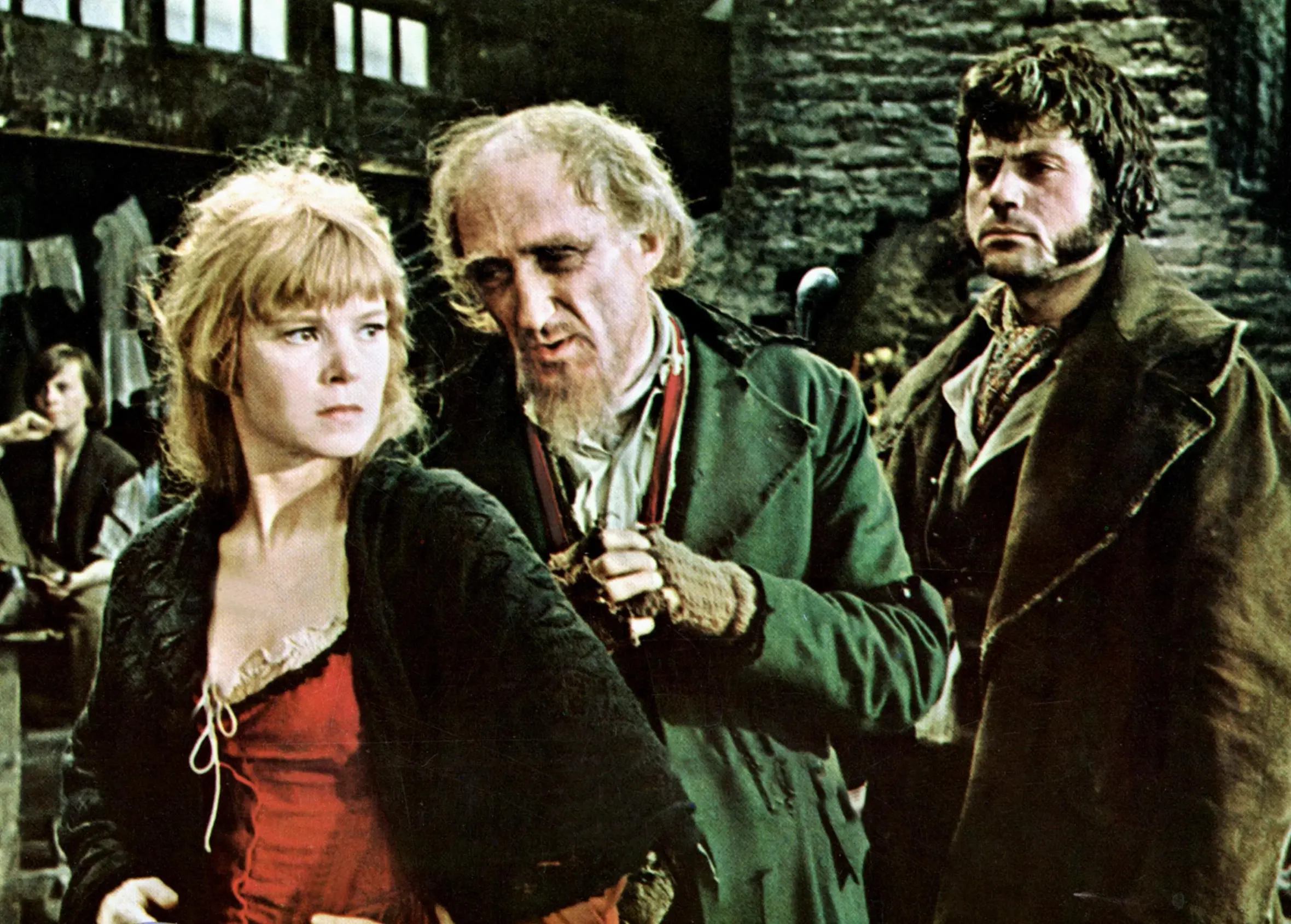 Shani Wallis, Ron Moody, and Oliver Reed in a film still from "Oliver!"
